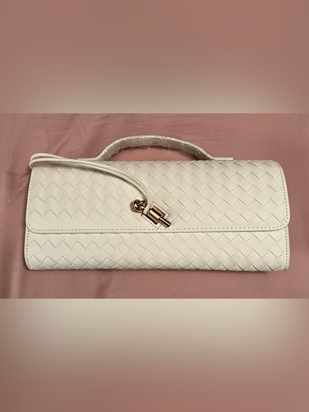 Woven White faux Leather Top-Handle Clutch with extension strap.